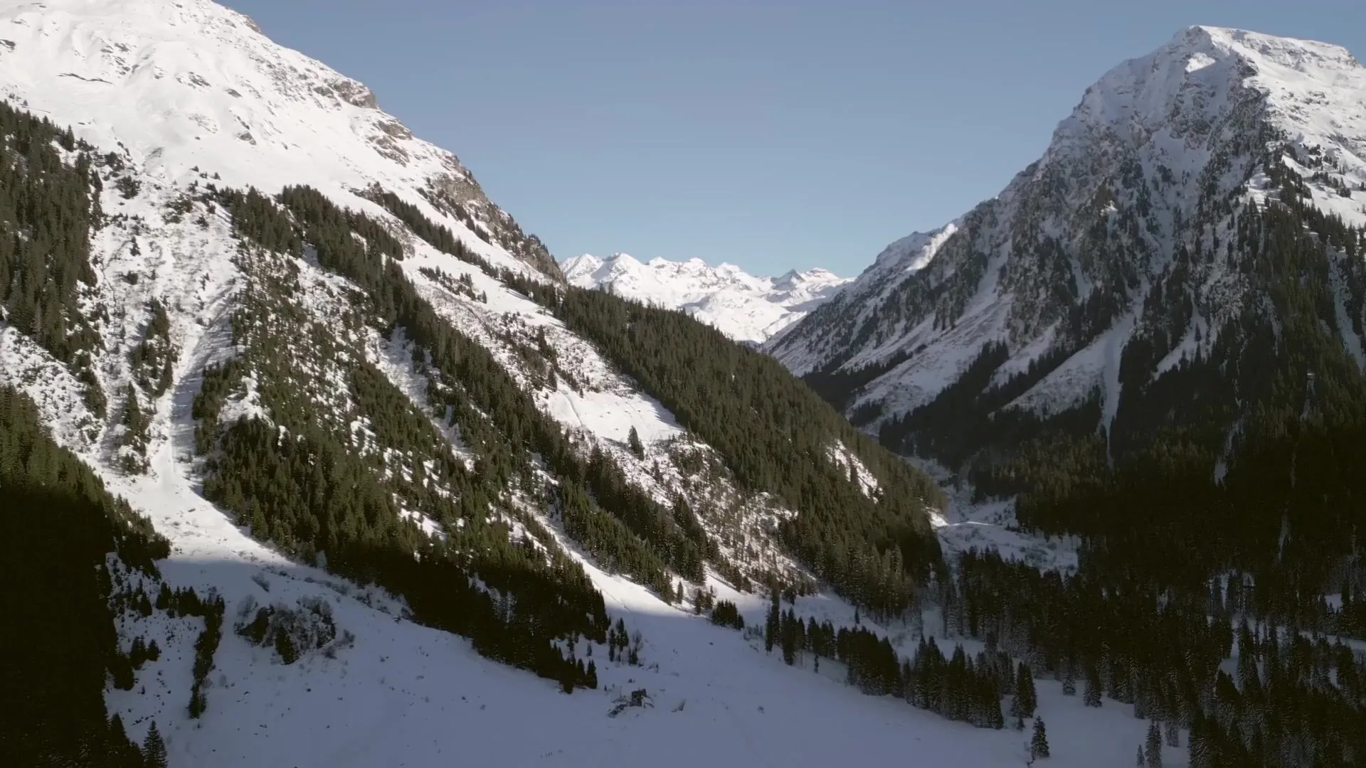 A snowy mountain valley, a still from Original Score: Lost